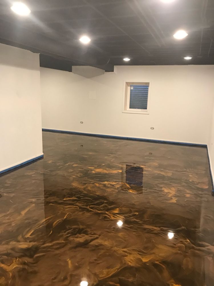 Metallic epoxy transforms concrete floors into a work of art with its striking, high-gloss finish and deep, 3D-like marbling effects. Ideal for garages, basements, and showrooms, this unique coating combines durability with a luxury aesthetic. for Lakeside Garage Floors in Chicago, IL