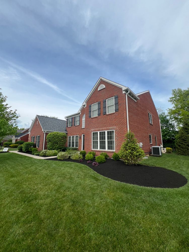 Enhance your landscape with our professional mulch installation service, providing quality materials and expert application to ensure long-lasting appeal, improved soil health, moisture retention, and weed control for your home. for Woolf Outdoor Services in Mason, OH