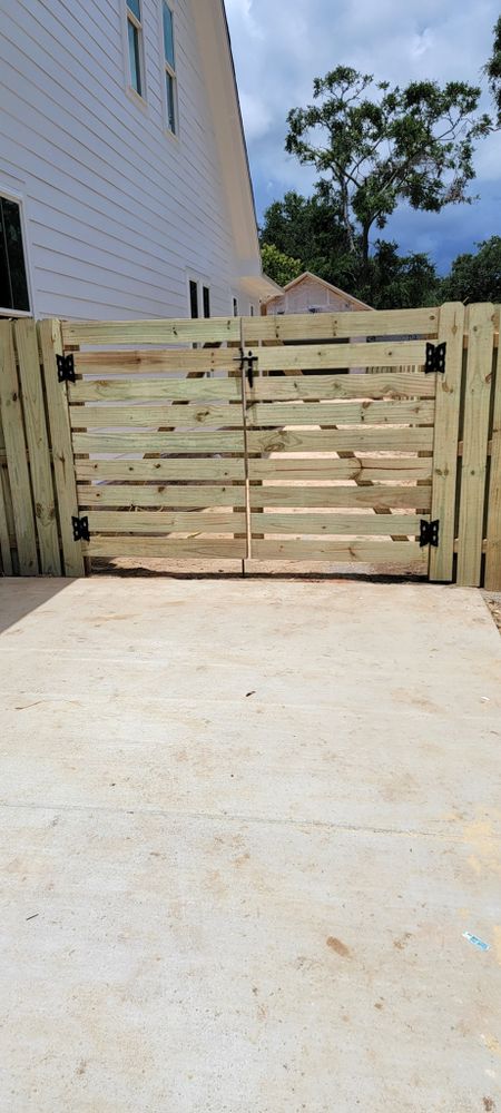 Our professional gate installation and repair service ensures enhanced security and aesthetic appeal for your home, featuring expertly crafted gates tailored to fit your needs with reliable maintenance for lasting performance. for Van Matre Fence, LLC in Pensacola Beach, FL
