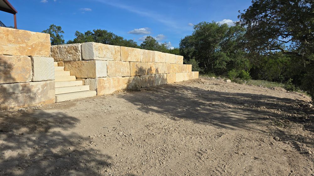 Limestone blocks retaining wall  for De Leon Carpentry & Renovation  in Leakey, TX