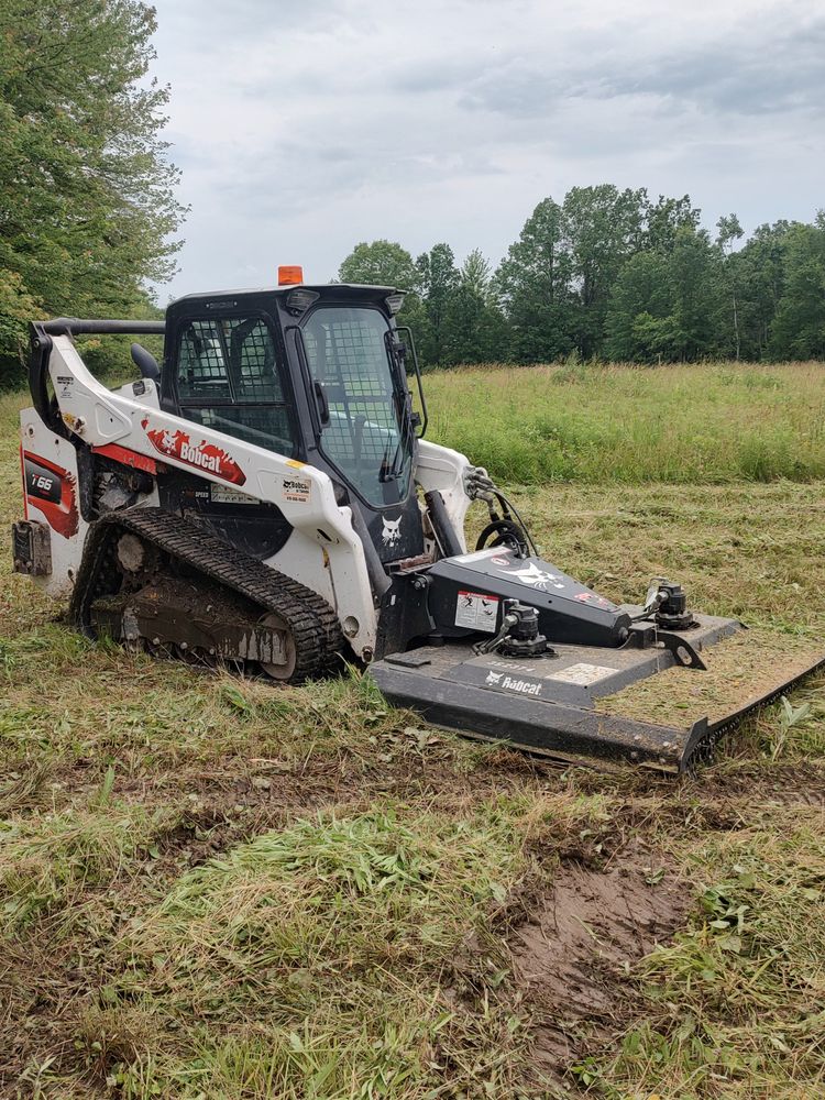 Enhance your home's safety and curb appeal with our Brush Clearing service, expertly removing overgrown vegetation to prepare areas for concrete installations or maintain a neat landscape. for Henceroth Construction in Amherst, OH