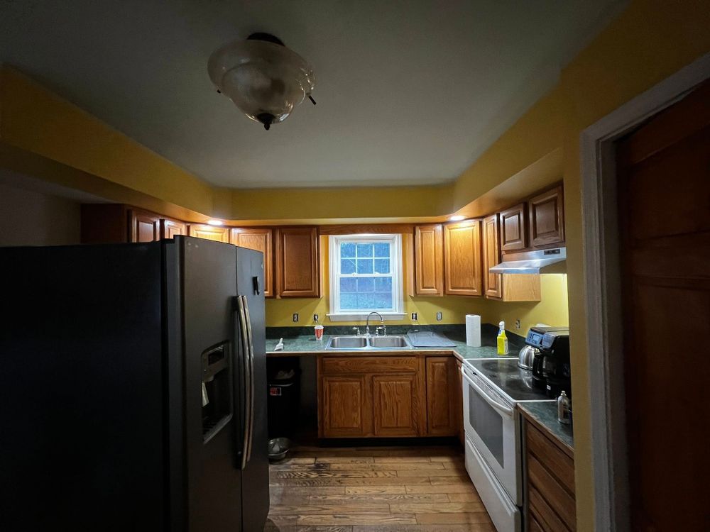 Transform your kitchen affordably with our cabinet refinishing service. We clean, repair, sand, and apply durable finishes that refresh cabinets beautifully, giving homeowners a like-new look without full replacement costs. for Green Valley Painting in Thompson, CT