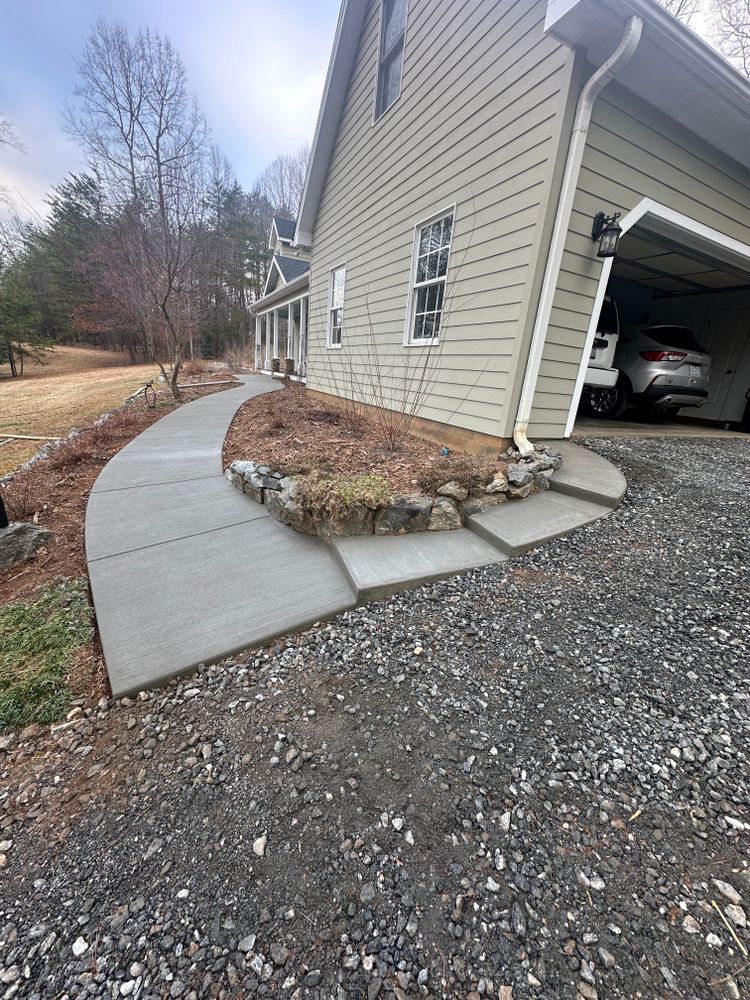 Enhance your home’s curb appeal with our expert sidewalk installation service, offering durable and aesthetically pleasing concrete pathways that ensure safe and stylish access to your property. for J & Son Construction LLC in Forest City, NC
