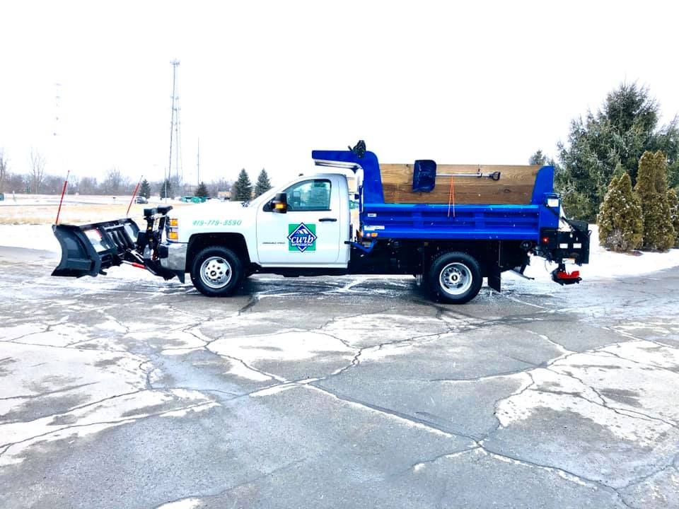 Our Snow Removal service is the perfect solution for keeping your property safe and accessible during the winter. We will clear your driveway, sidewalks, and steps quickly and efficiently to help you stay on schedule during the cold weather. for Curb Impressions in Toledo,  OH