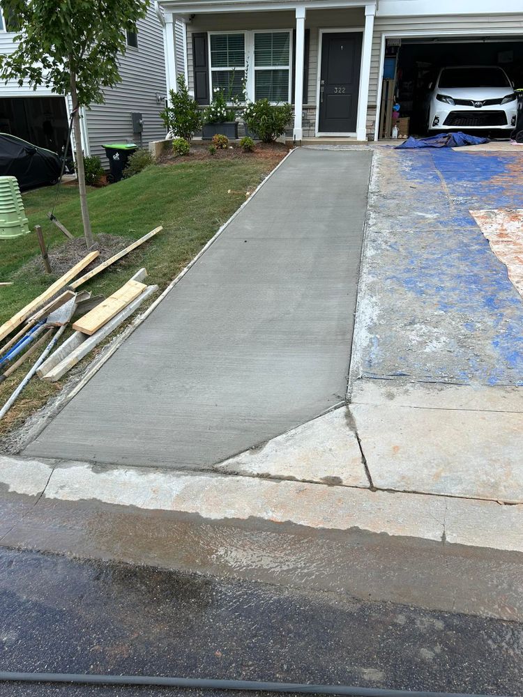 Our concrete services offer expert repair solutions for cracks, settling, and surface damage to ensure durability and enhance the aesthetic appeal of your home’s concrete structures. for DH Construction & Concrete in Roebuck, SC