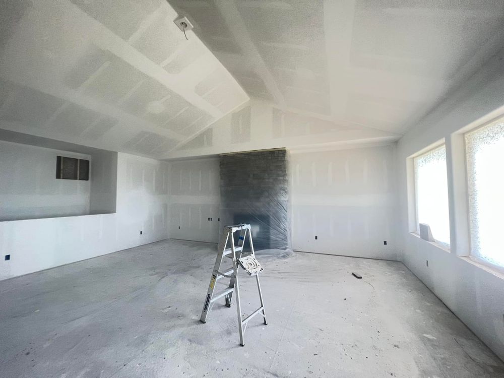 Our Drywall and Plastering service ensures a flawless and smooth finish to your walls, enhancing the overall aesthetic appeal of your home during renovations. for Ferrer's Interiors in Centerton, AR