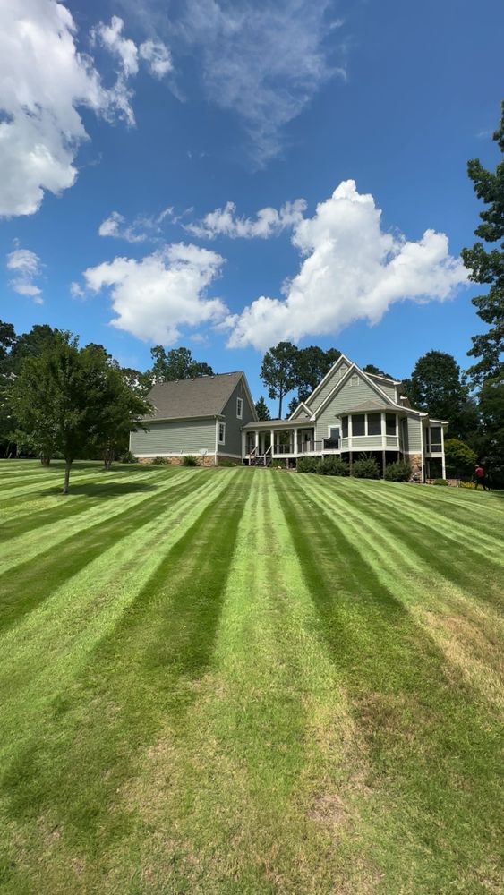 Our mowing service provides precise, efficient lawn care that enhances your home's curb appeal, ensuring a beautifully manicured landscape with professional expertise and reliable scheduling for hassle-free maintenance throughout the growing season. for Jameson’s Landscaping & Pressure Washing in Eatonton, GA