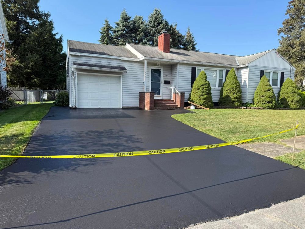 Protect and refresh your driveway with our professional sealcoating service. We apply a durable, weather-resistant barrier that enhances appearance, prevents damage from water, sun, and chemicals, and extends asphalt life. for Dibbles Asphalt Maintenance in Westernville, NY