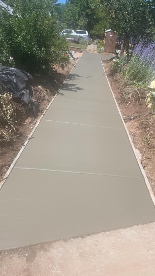 Enhance your home's curb appeal with our professional sidewalk installation service, providing durable and aesthetically pleasing paths that complement any landscape while ensuring safety and accessibility for all visitors. for 3 Brothers Construction in Durango, CO