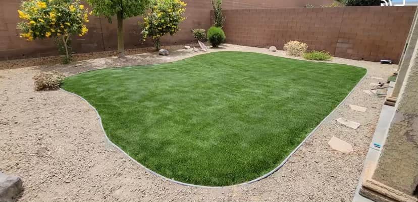 Our turf installation service provides homeowners with a beautiful, low-maintenance lawn that enhances the overall aesthetic of their property. Say goodbye to mowing and watering - let us handle it! for Top It Off Landscaping LLC in Henderson, NV