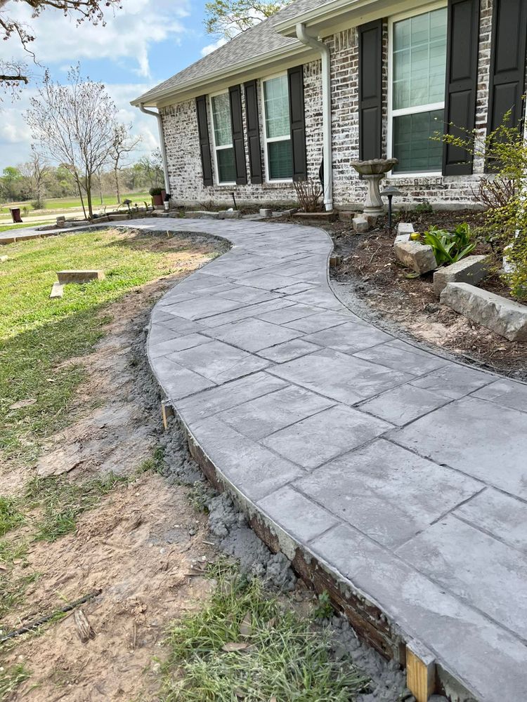 Enhance your home's curb appeal with our expert stamped concrete installation, offering durable, customized designs that mimic stone or brick textures to beautifully elevate patios, driveways, and walkways. for Mel Concrete and Construction in College Station, TX