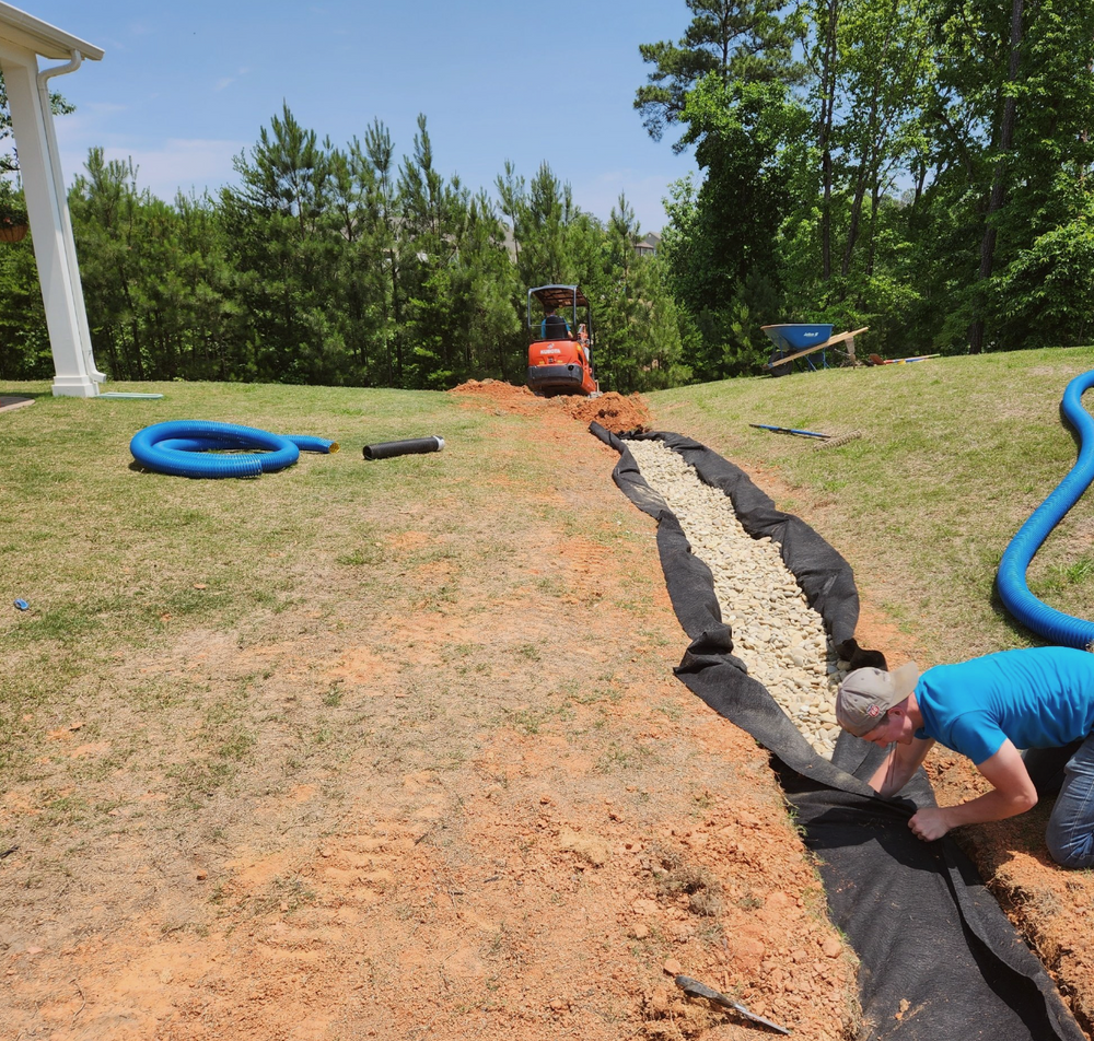 Our French Drains service helps prevent water buildup in your yard by directing excess water away from your property, protecting it from potential flooding and keeping your landscape healthy. for Drain My lawn in Monroe, NC