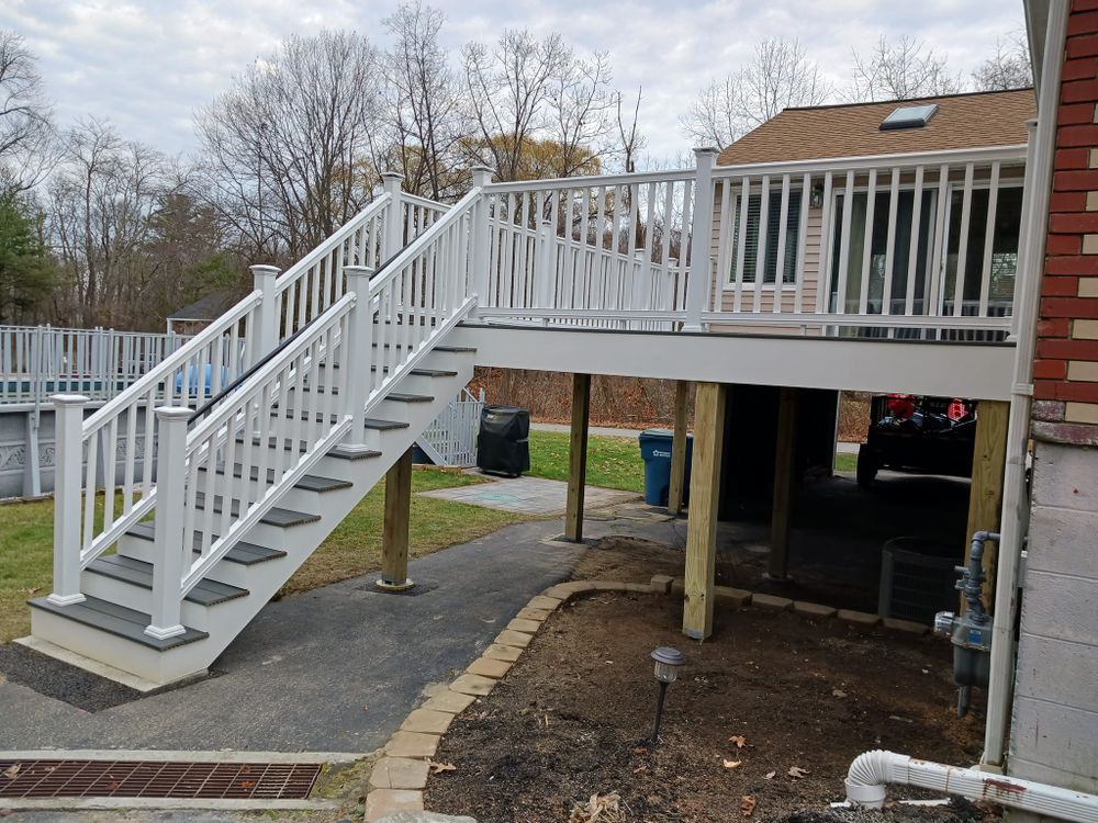 Our Deck Installation service offers homeowners a professional and reliable solution for enhancing their outdoor living space with a beautiful and durable deck. for Roeger Property Solutions in Haverhill, MA