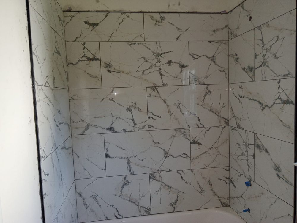 Transform your bathroom into a stunning oasis with our expert renovation services. We offer custom designs, quality materials, and skilled craftsmanship to elevate functionality and aesthetic appeal in every project. for Iron Man Construction in Charlotte, NC