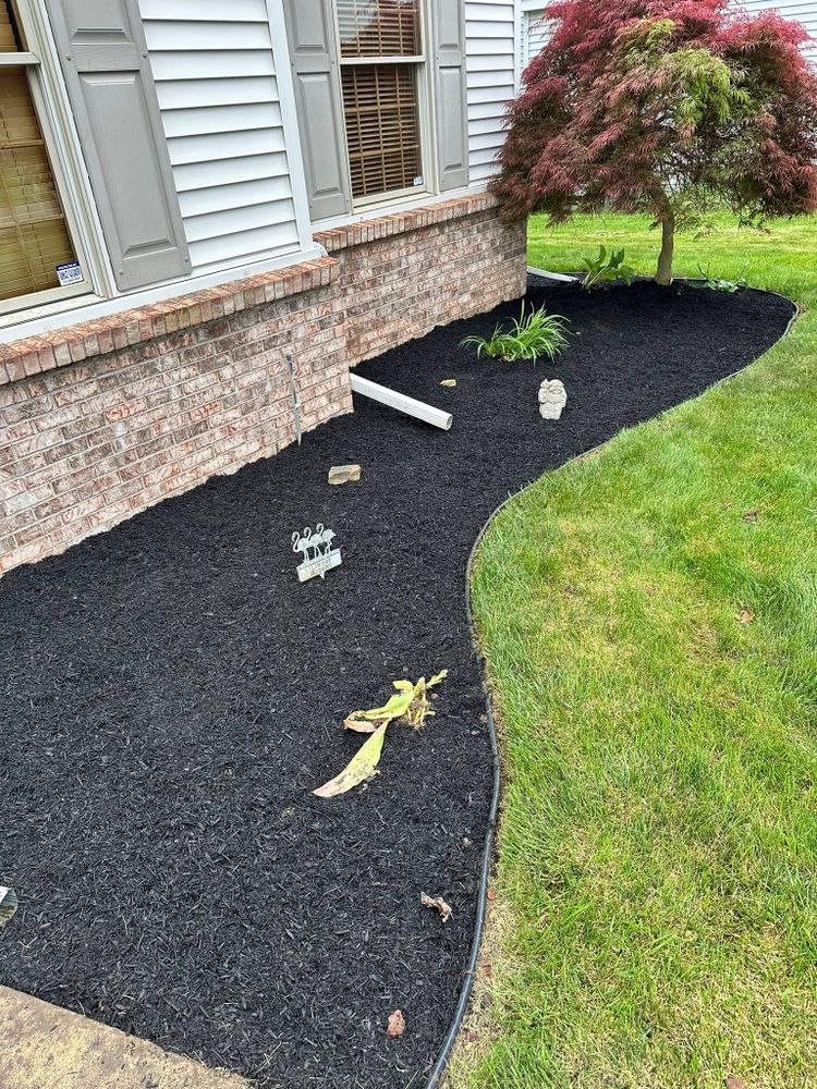 Enhance your garden's beauty and health with our professional mulch installation service. We expertly apply high-quality mulch to conserve moisture, suppress weeds, and provide a polished look for your landscape. for Sargent's Lawn and Property Maintenance LLC in Lambertville, MI