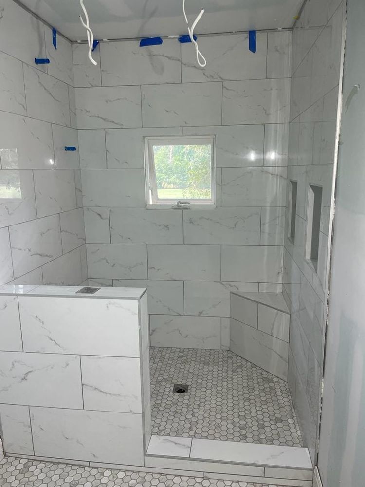 Our Tile Showers & Backsplash service offers homeowners the opportunity to enhance their bathrooms and kitchens with beautiful, durable and customizable tiling options. for Amazing Flooring LLC in Bluffton, SC