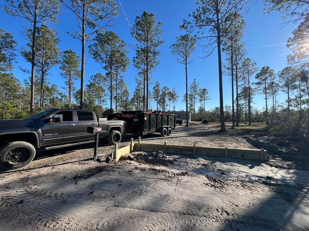 Enhance your outdoor space with our expertly designed retaining wall solutions, providing essential support and beautiful landscaping integration to prevent erosion while adding value and charm to your home. for Santos Landscape in Waycross, GA