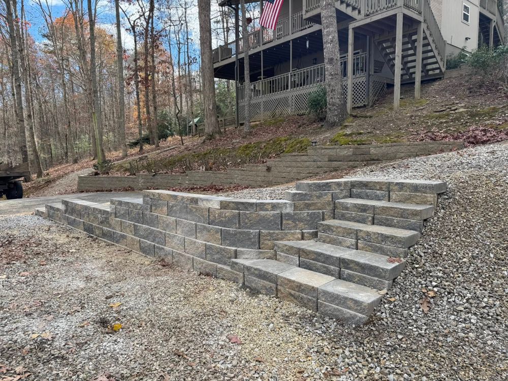 Enhance your outdoor space with our expert Retaining Wall Construction service, designed to improve soil stability, prevent erosion, and create a beautiful and functional landscape tailored to your home's unique needs. for C & D Landscaping Services in Blairsville, GA