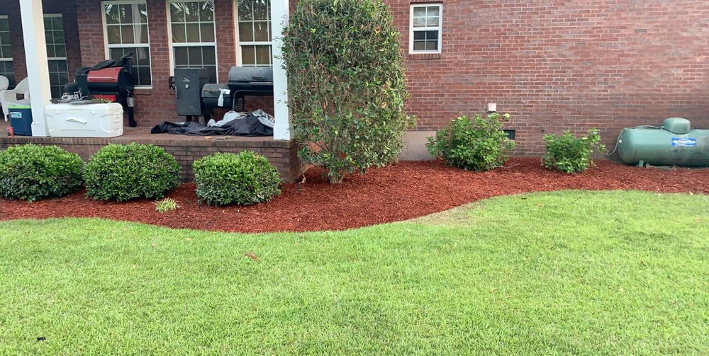 Our mulching service enhances your landscape by retaining moisture, reducing weeds, regulating soil temperature, and creating a clean, polished appearance that helps plants thrive and boosts your home’s curb appeal. for Miracle Works Landscaping in Albany, GA
