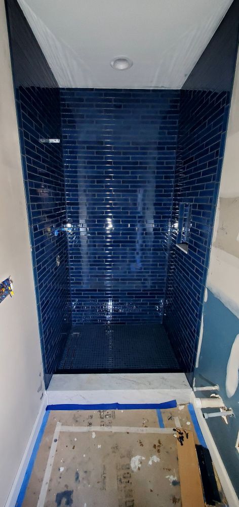 Transform your bathroom with our Tile Shower service. Our expert team will design and install a beautiful, durable shower that enhances the value and appeal of your home. for D&J Custom Floors in Nederland, TX