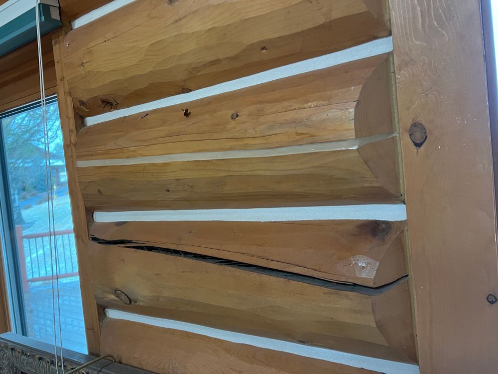 Enhance your log home's durability and energy efficiency with our expert chinking service, providing high-quality sealant to prevent drafts and moisture infiltration while maintaining its rustic charm. for True Blue Logworks LLC in Corvallis, MT