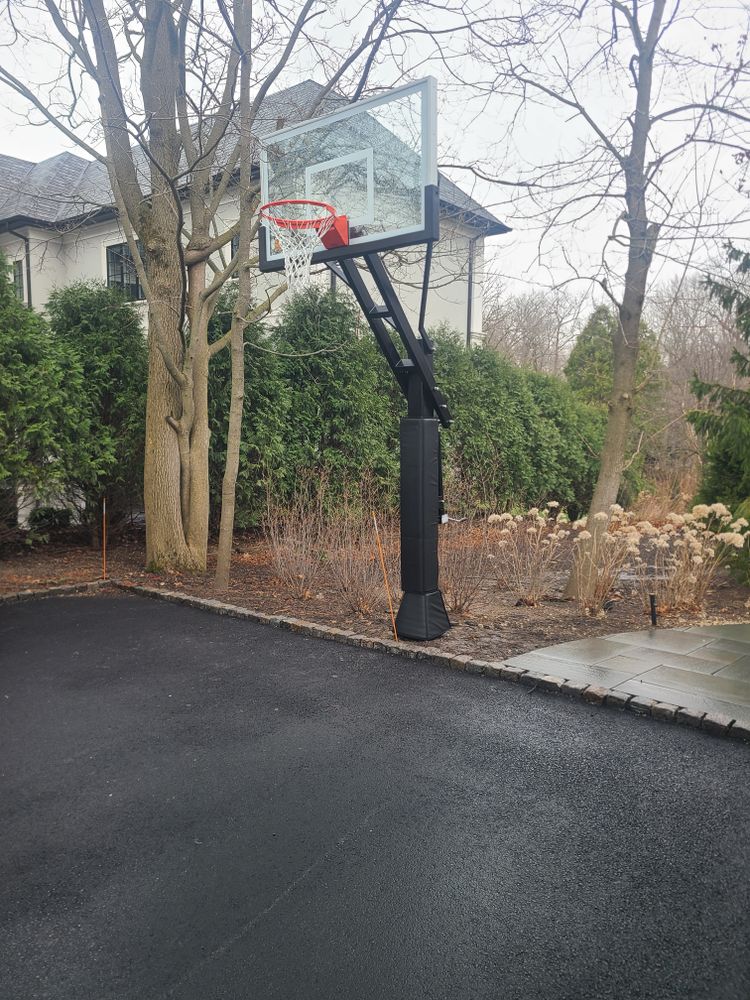 Our basketball hoop installation service complements your fence installation, providing a seamless and professional setup to enhance your outdoor space with added recreational options for family fun and fitness. for Fence Medic in Northbrook, IL