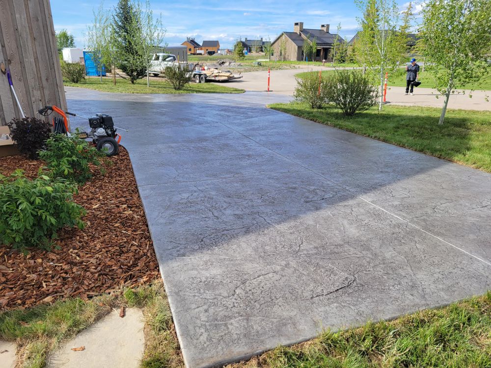 Enhance your home's curb appeal with our professional stamped concrete installation, offering durable, customizable patterns and textures that beautifully mimic stone, brick, or tile. for Those Guy’s Specialty Concrete in St. George, UT