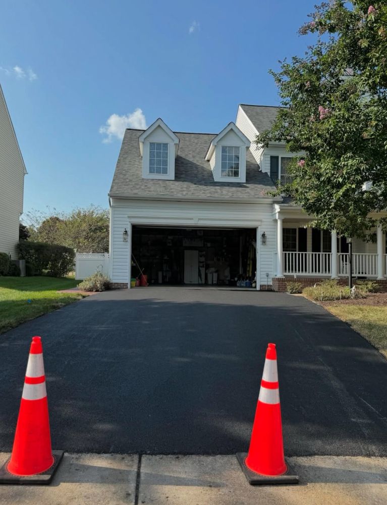 Our Driveway Paving service offers durable and aesthetically pleasing asphalt solutions, enhancing your home's curb appeal with expert craftsmanship, reliable materials, and efficient installation to ensure lasting quality. for Blue Ridge Paving & Chip in Charlottesville, VA