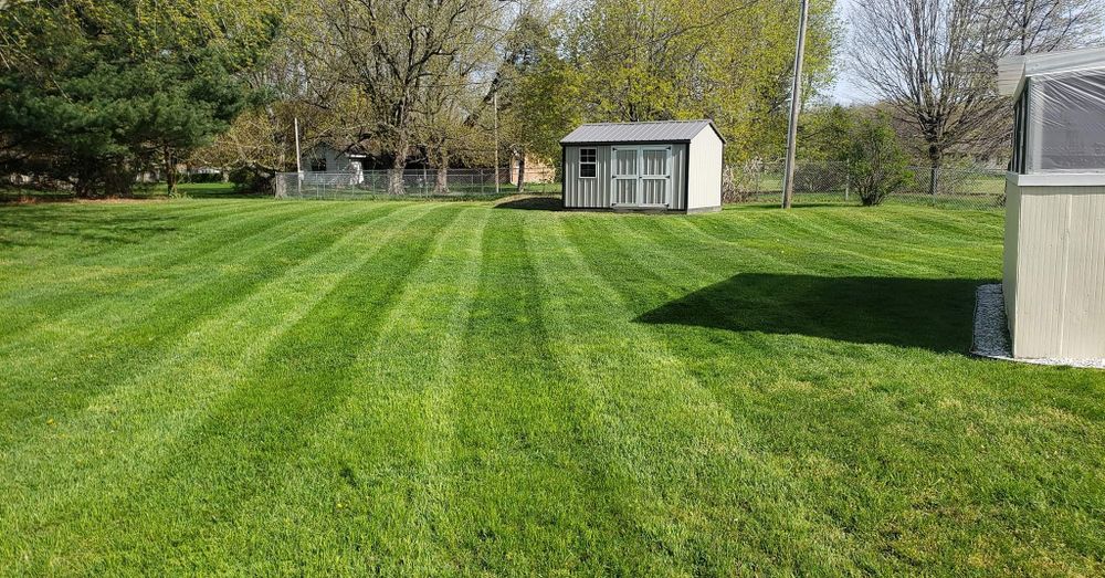 Enhance your lawn's health with our professional aeration service, which improves soil circulation, boosts nutrient absorption, and promotes robust grass growth for a lush, vibrant landscape you’ll love. for Land Movers in Kalamazoo County, MI