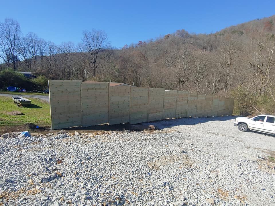 Enhance your home's privacy with our custom Privacy Walls. Offering stylish designs and durable materials to create a peaceful oasis while seamlessly blending with your existing landscaping and hardscaping aesthetics. for Lafollette Mulch, Stone and Lawn Care in La Follette, TN