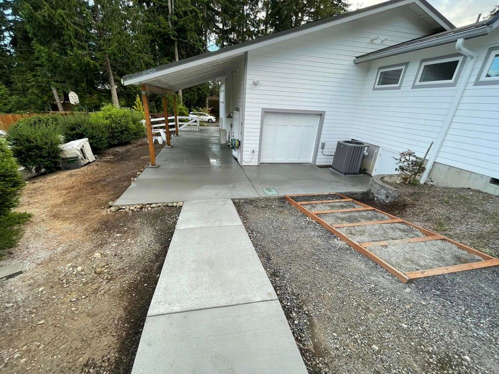 Our Sidewalk Installation service provides homeowners with professionally poured and finished concrete walkways that enhance the aesthetic appeal and functionality of their property, adding value to their home. for A Paradise Concrete & Construction  in  Renton,  WA