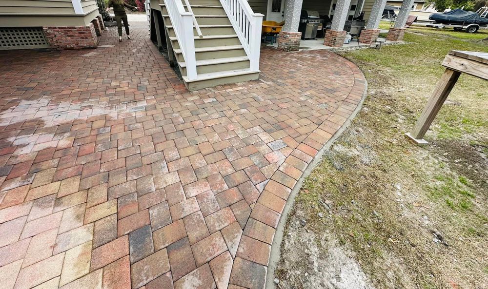 Our Pavers service offers a variety of high-quality and durable options for creating stunning pathways, driveways, and patio areas that will enhance the beauty and functionality of your outdoor space. for George’s Hardscape  in Bluffton, SC