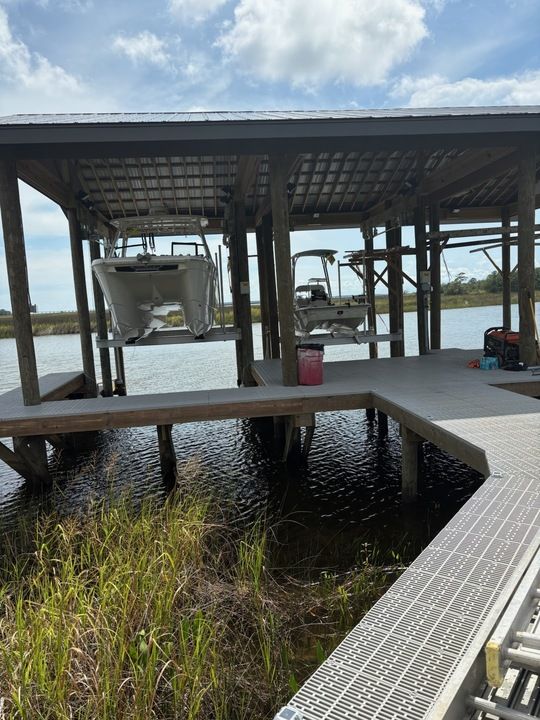 Our Boat Lift Construction service provides durable and custom solutions to securely hoist and protect your watercraft, ensuring easy access and safeguarding your investment from damage while enhancing waterfront property value. for Coastal Marine Construction in Bay St. Louis, MS