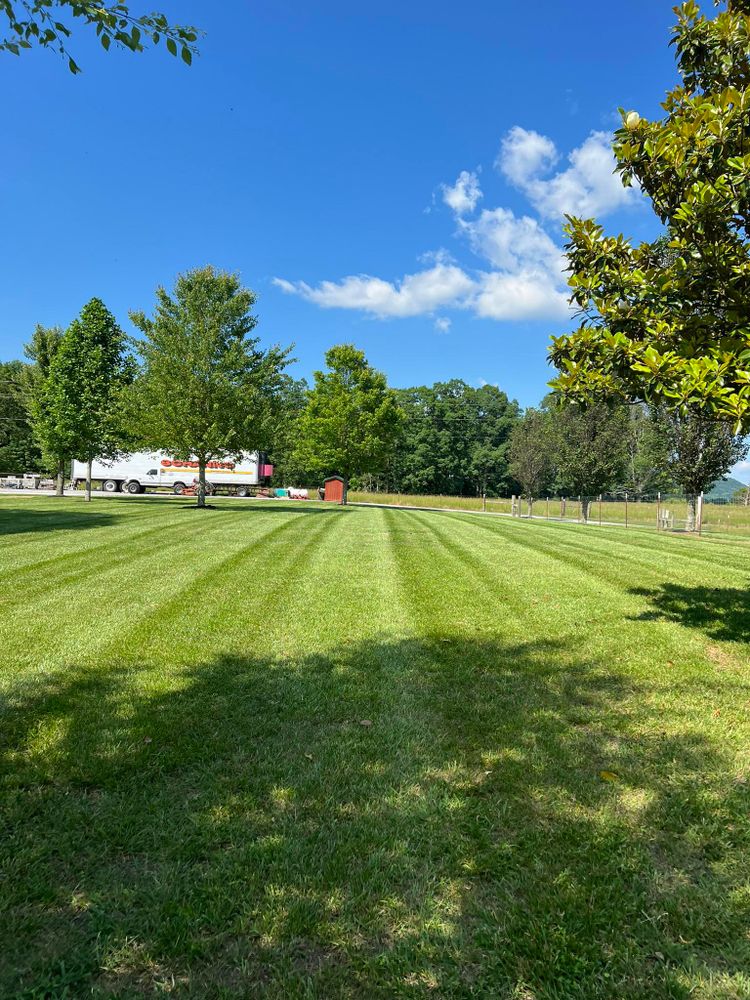 Enhance your home's curb appeal with our expert lawn maintenance services, providing regular mowing, trimming, and edging to ensure a lush, healthy landscape that complements your outdoor living space beautifully. for Arnold’s Outdoor Solutions in Woodbury, TN