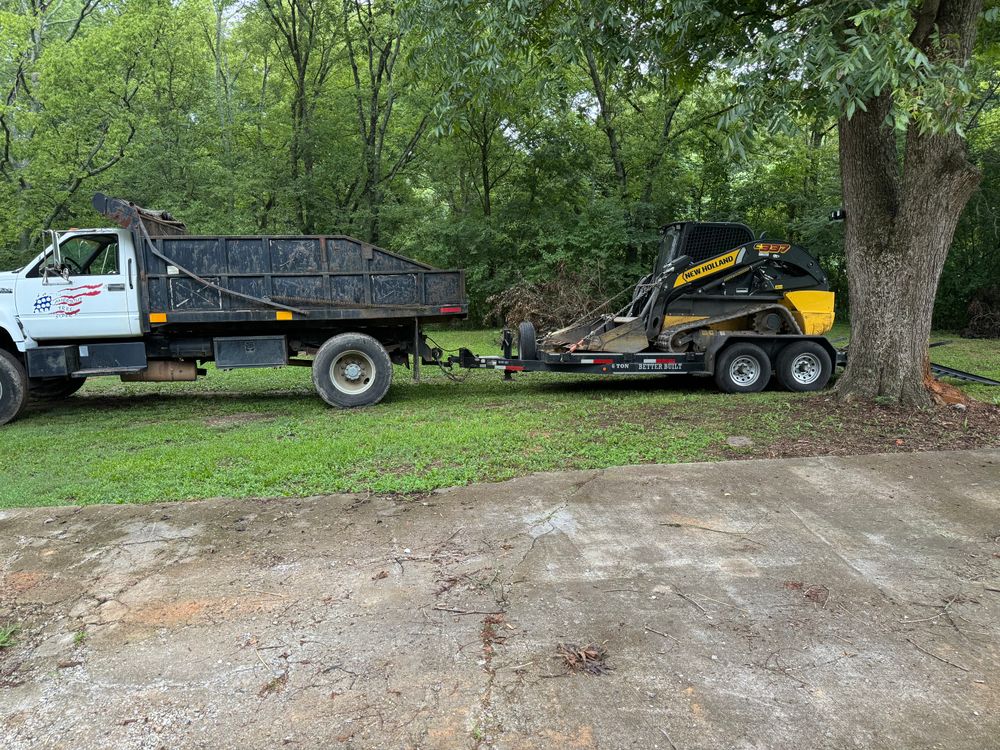 Our Gravel Hauling Driveway Repairs service ensures a smooth and durable driveway surface by efficiently delivering high-quality gravel and expertly filling in any cracks or potholes, enhancing the curb appeal of your home. for Reed Construction Services LLC in Cartersville, GA