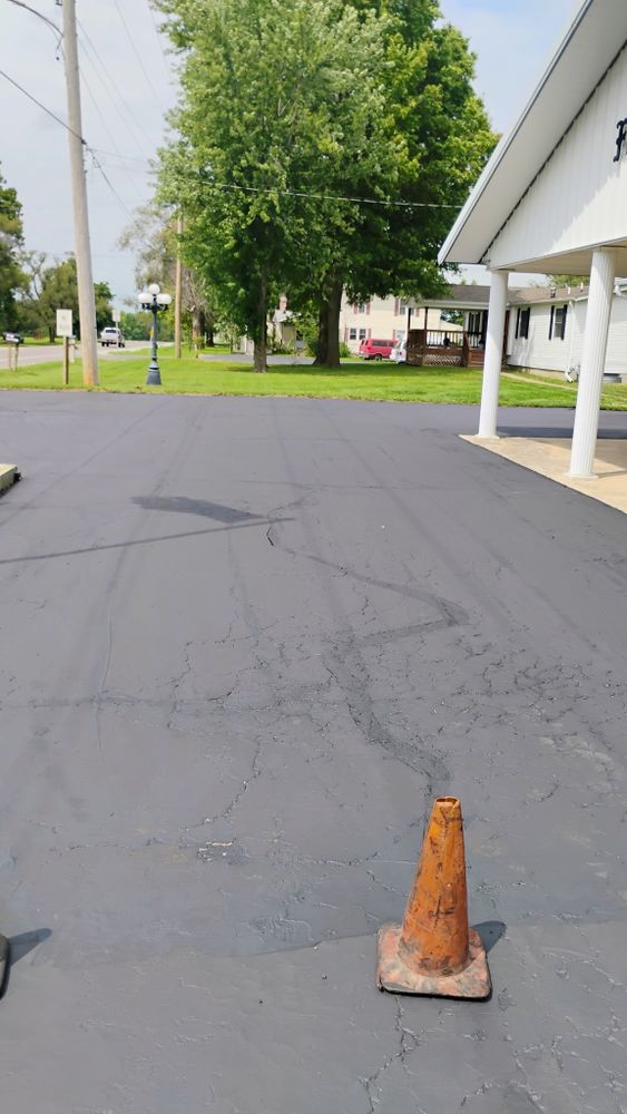 Enhance your home's curb appeal with our Commercial Asphalt Services, offering durable, smooth surfaces for driveways and parking areas. Trust our skilled team to deliver quality results tailored to your needs. for Bishop Asphalt Sealcoating in Marceline, MO