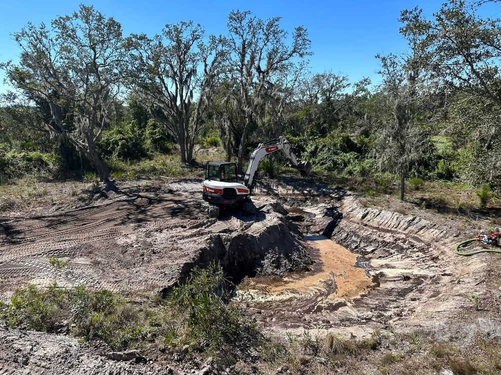 Transform your outdoor space with our professional pond excavation service, designed to enhance aesthetic appeal and functionality. Trust our experts for precise, efficient digging tailored to your landscape vision. for Windspirit Land Services in Hillsborough County, FL