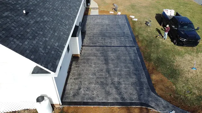 experience the beauty and durability of our stamped concrete installation service, transforming your outdoor spaces with customized designs that mimic natural stone or brick, enhancing both aesthetic appeal and property value. for Rivera Concrete INC. in Greensboro, NC