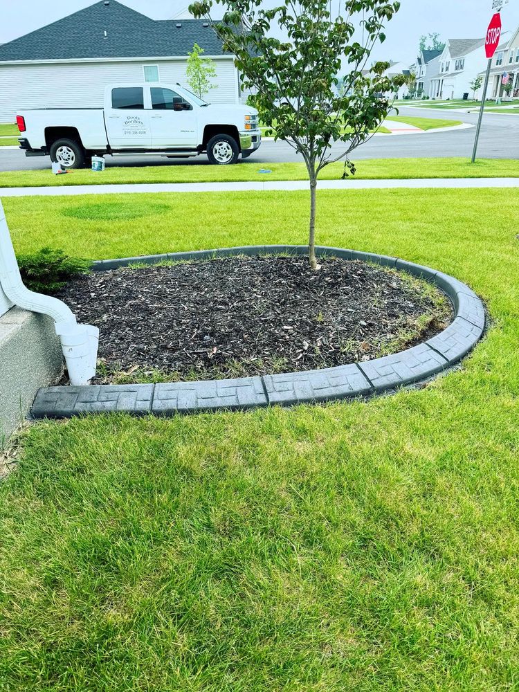 Enhance your home's curb appeal with our comprehensive Lawn Maintenance service, offering expert mowing, edging, fertilization, and tailored care to ensure a lush and vibrant lawn year-round. for Boots Borders in Westville, IN