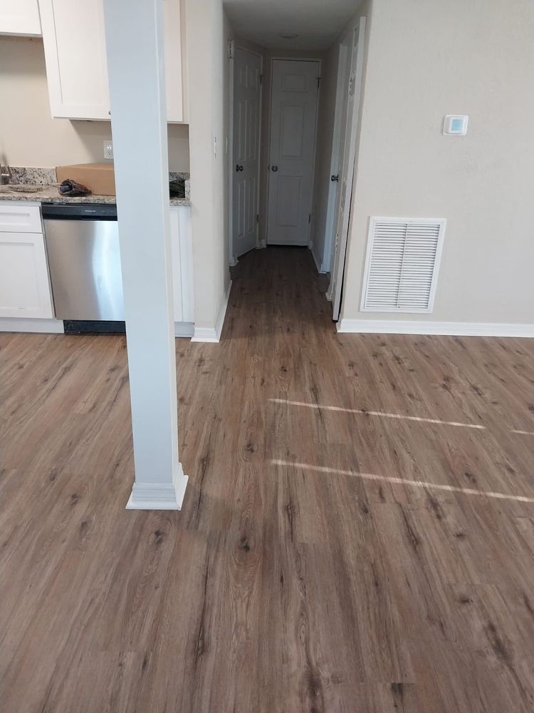 Our Floor Repair service restores the beauty and functionality of your floors, addressing issues like scratches and wear, ensuring a seamless finish that enhances the overall appearance of your home. for Top Tier Tampa Flooring in Tampa, FL