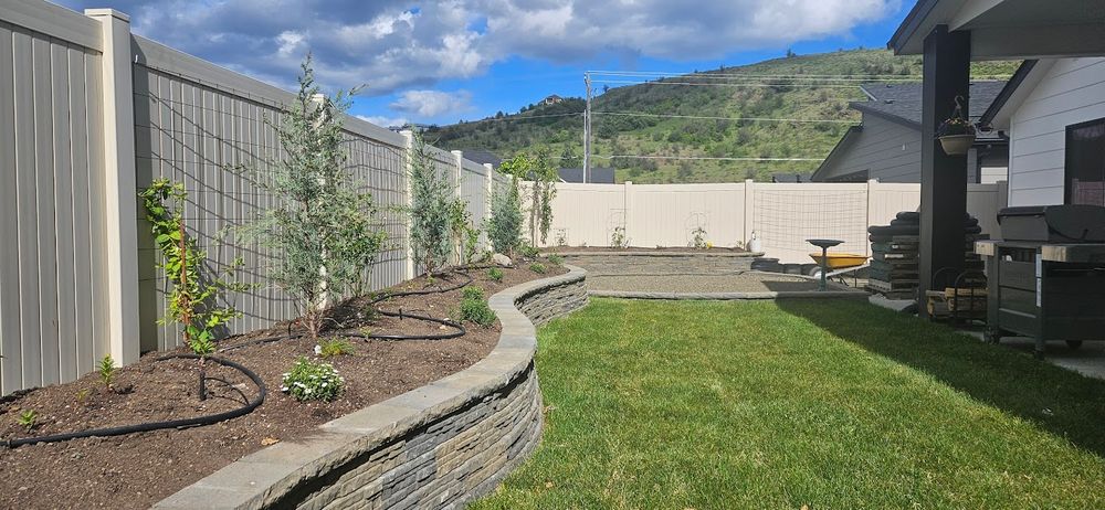 Our retaining wall construction service offers homeowners durable and aesthetically pleasing solutions to prevent soil erosion, enhance garden design, and create level spaces for a more functional outdoor living area. for Ida-Home Hardscapes in Coeur d'Alene, ID