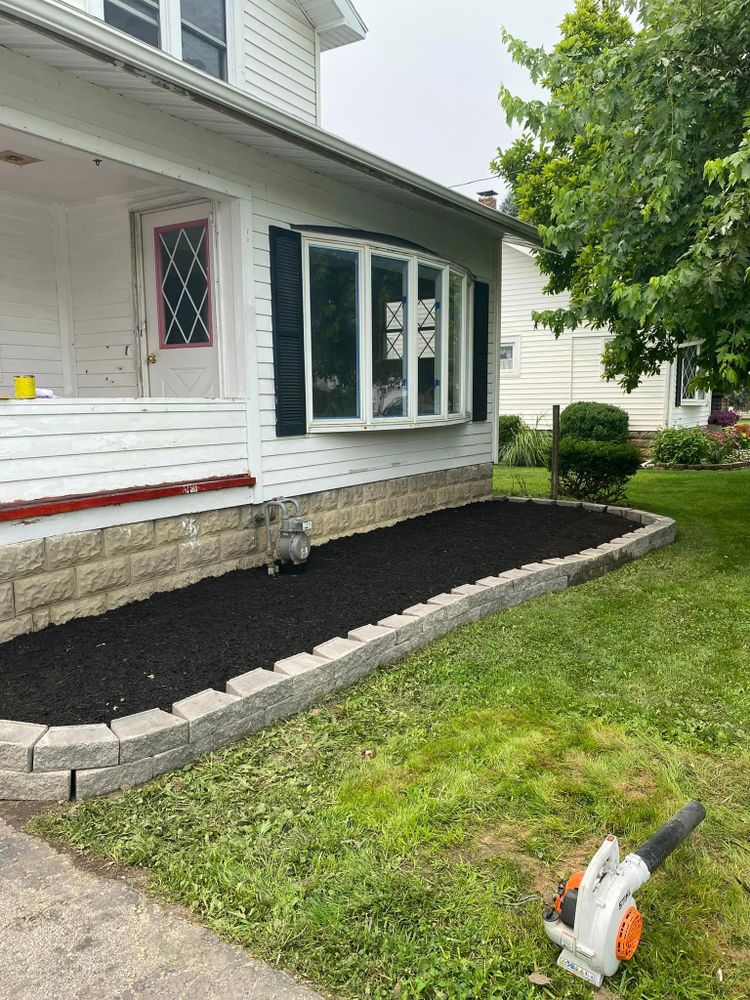 Enhance your landscaping with our Mulch Installation service, providing a protective barrier for plants, preventing weed growth, retaining moisture in the soil, and adding aesthetic appeal to your outdoor space. for OT Lawn and Landscaping LLC in Carey, OH