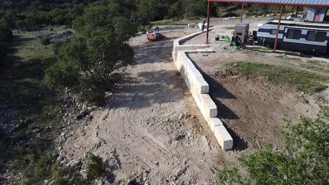 Limestone blocks retaining wall  for De Leon Carpentry & Renovation  in Leakey, TX