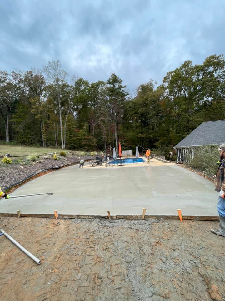 Elevate your outdoor living space with our expert Patio Design & Installation service. Our team will transform your backyard with durable and stylish concrete patios tailored to your unique preferences. for Stillwell Earthworks in Trussville, AL