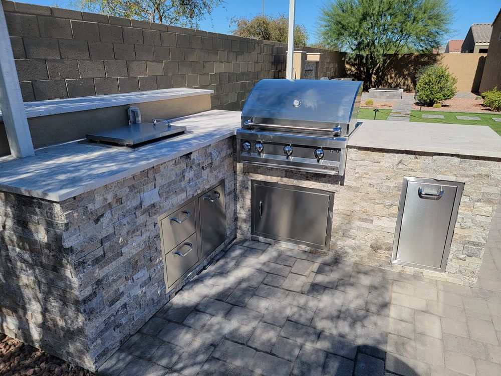 Enhance the luxury in your backyard with our expert outdoor kitchen design and installation services, creating a perfect space for entertaining and enjoying culinary delights in the comfort of your own home. for Zeescapes Design Concepts in Mesa, AZ
