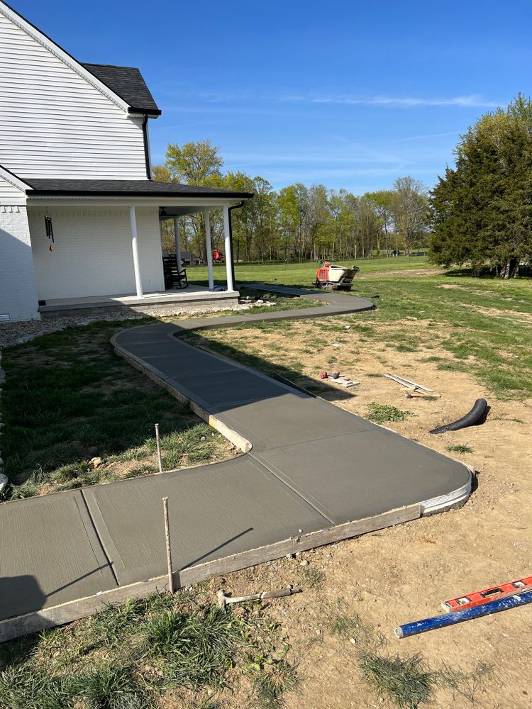 Enhance your home's curb appeal and functionality with our professional Sidewalk Installation service. Our experienced team will expertly install durable and visually appealing sidewalks to improve your property. for Blevins Concrete in Greencastle, IN