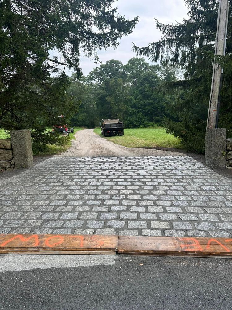 Transform your outdoor space with our Natural Stone Hardscape service, offering expertly crafted patios, walkways, and retaining walls that blend beauty with durability for a lasting impression on your home landscape. for E. Gordon Construction in Dighton, MA