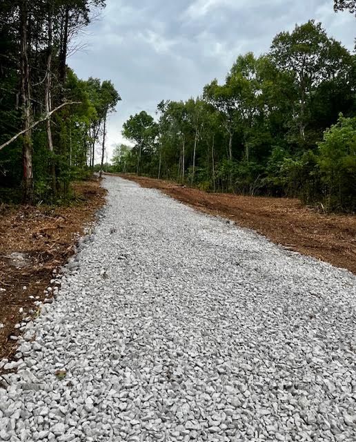 Our Driveway Construction service includes clearing and leveling land, laying a sturdy foundation, and surfacing with durable materials to create a smooth and long-lasting entrance for your home. for TriStar Land Clearing & Mulching in Murfreesboro, TN