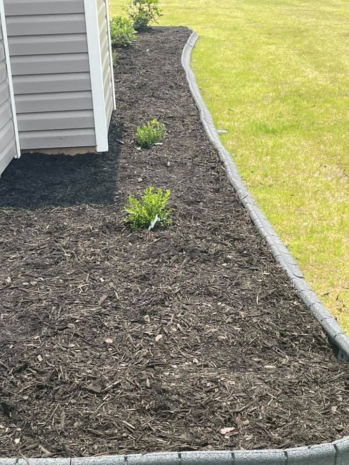 Enhance your home's curb appeal with our professional mulch installation service, providing nutrient-rich coverage that conserves moisture, suppresses weeds, and adds a polished look to your garden beds. for Sparks Landscaping in Augusta, GA