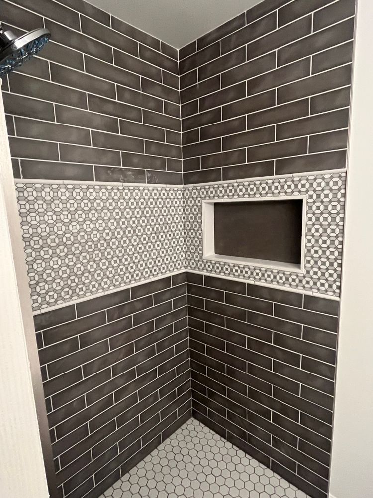 Tile showers and tub surrounds for Chapman Surfaces Tile & Remodeling in Milan, MI